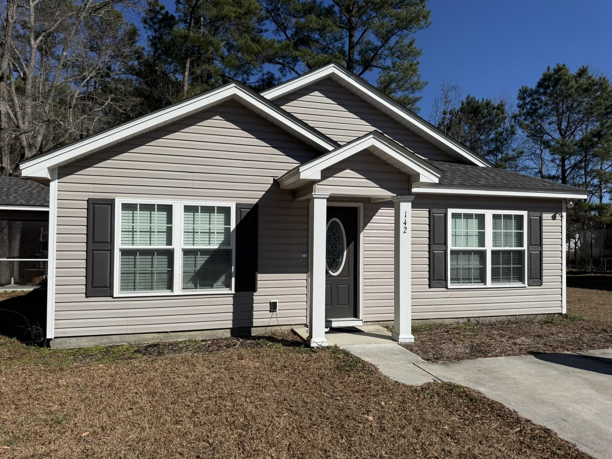 Bungalow-style house with a shingled roof