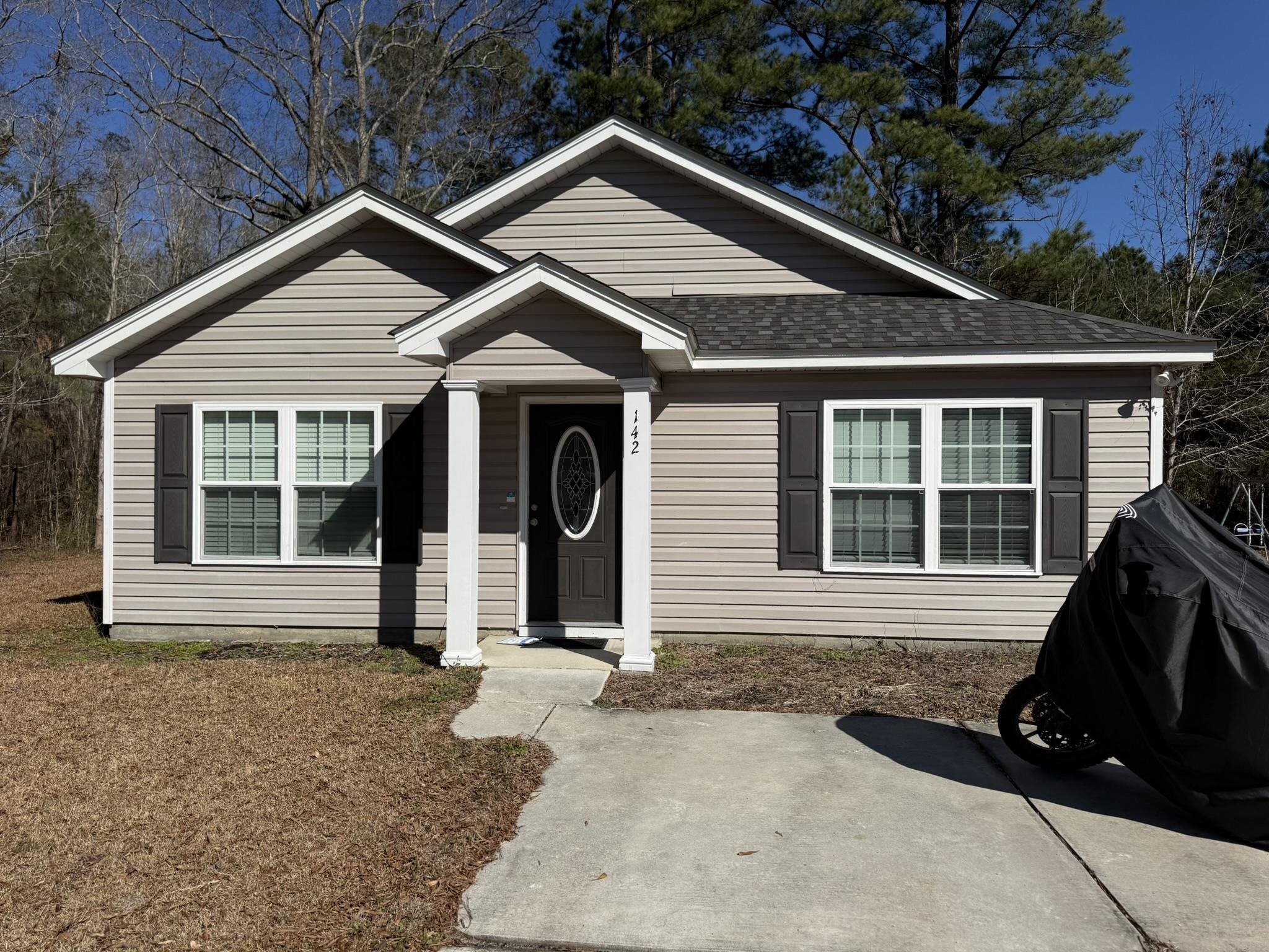 142 Desurrency Court Georgetown, SC 29440 - Photo 2 of 9 View of front of house featuring roof with shingles