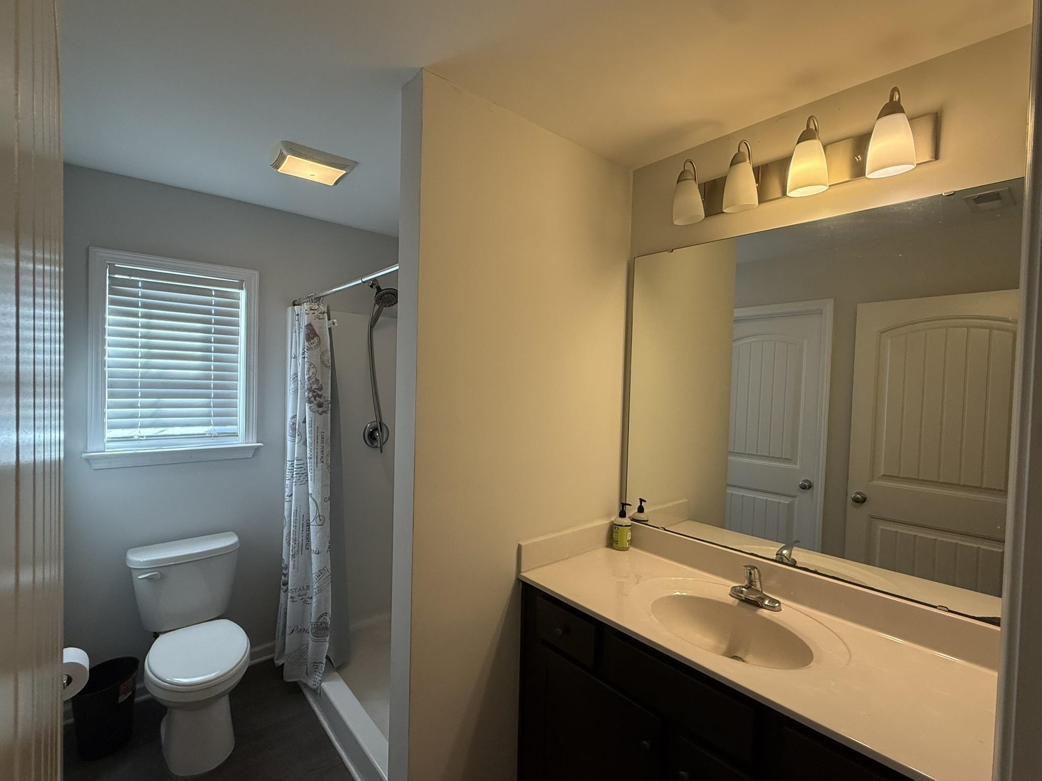 142 Desurrency Court Georgetown, SC 29440 - Photo 6 of 9 Full bathroom featuring a shower with curtain and vanity