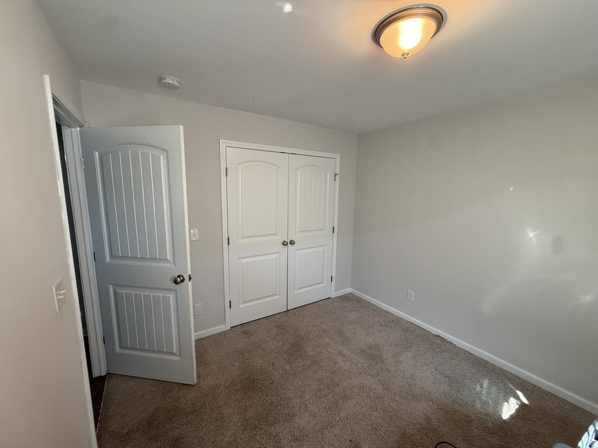 142 Desurrency Court Georgetown, SC 29440 - Photo 9 of 9 Unfurnished bedroom with dark carpet and a closet