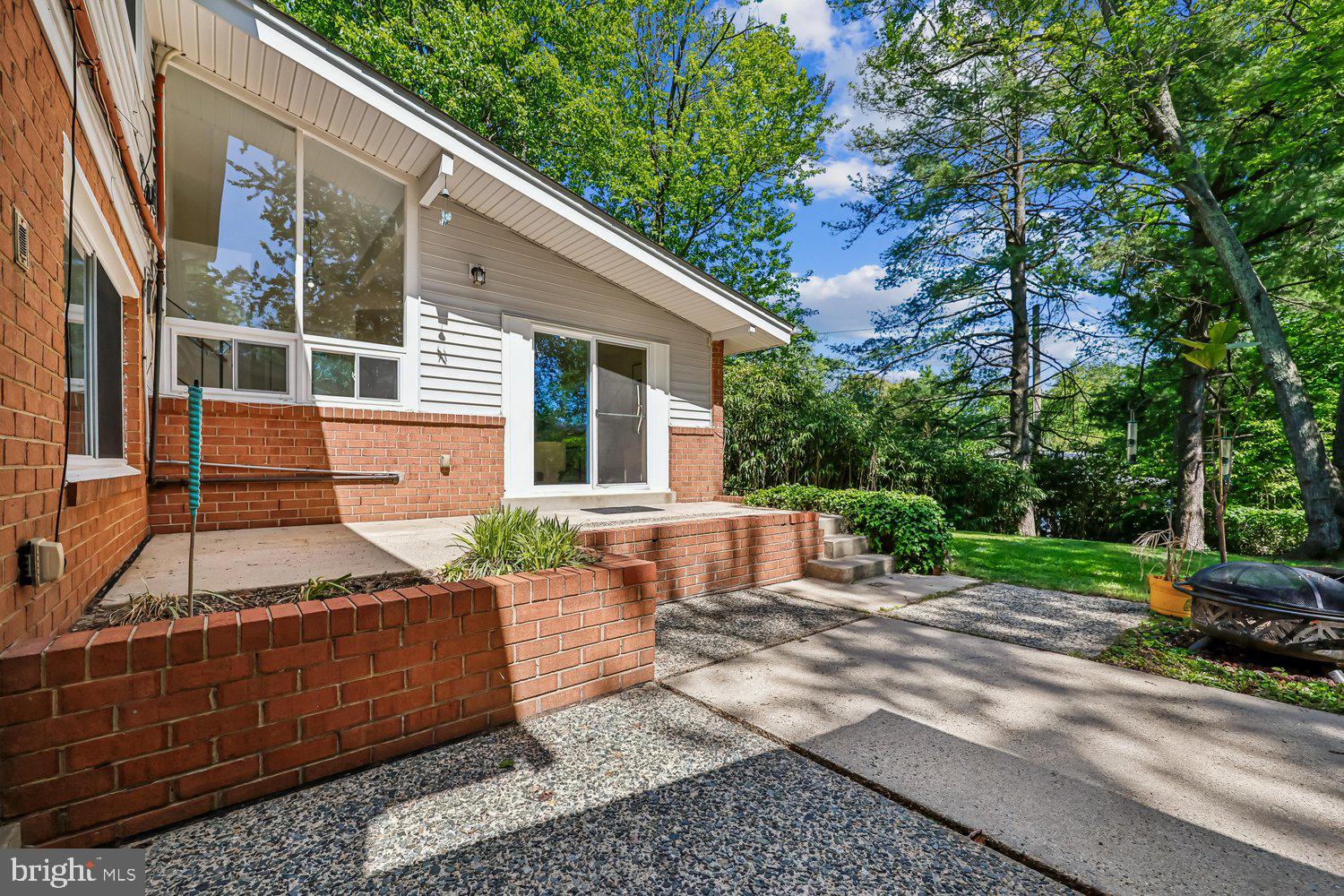 300 Gilsan Court Silver Spring, MD 20902 - Photo 24 of 117 a view of a house with a yard and sitting area