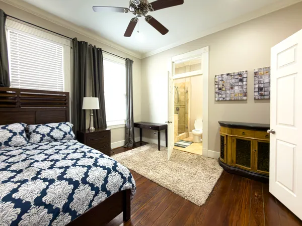 a bedroom with a bed next to a window with outer view