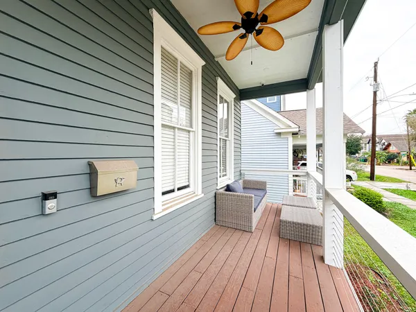a view of a deck with wooden floor and furniture