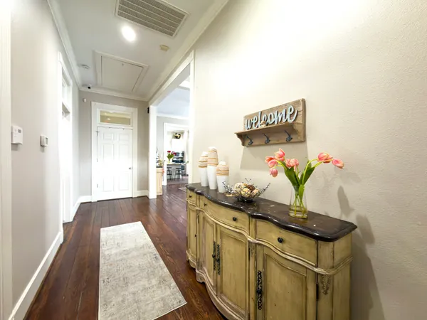 a view of living room with furniture and potted plant