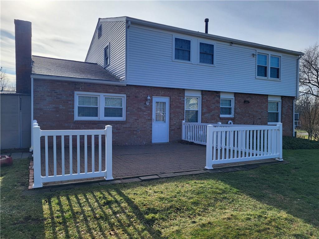 117 Farmington Drive Butler, PA 16001 - Photo 34 of 36 Back of the House with Brick Patio and Door Leading Into the Family Room...