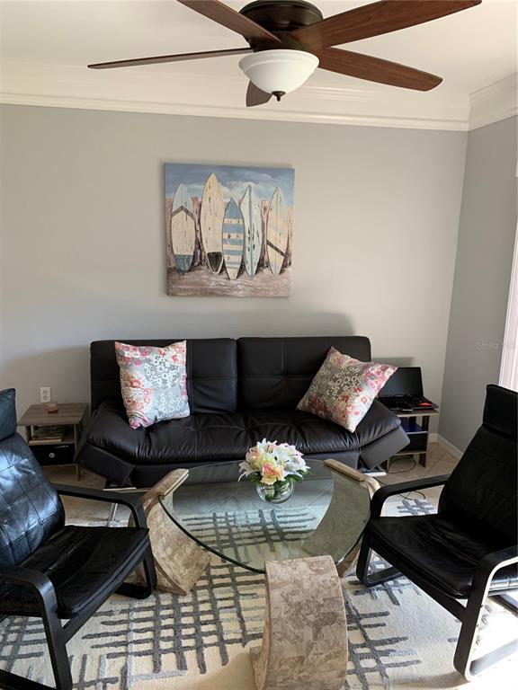 5134 Northridge Road, Unit 112 Sarasota, FL 34238 - Photo 11 of 15 a living room with furniture and wooden floor