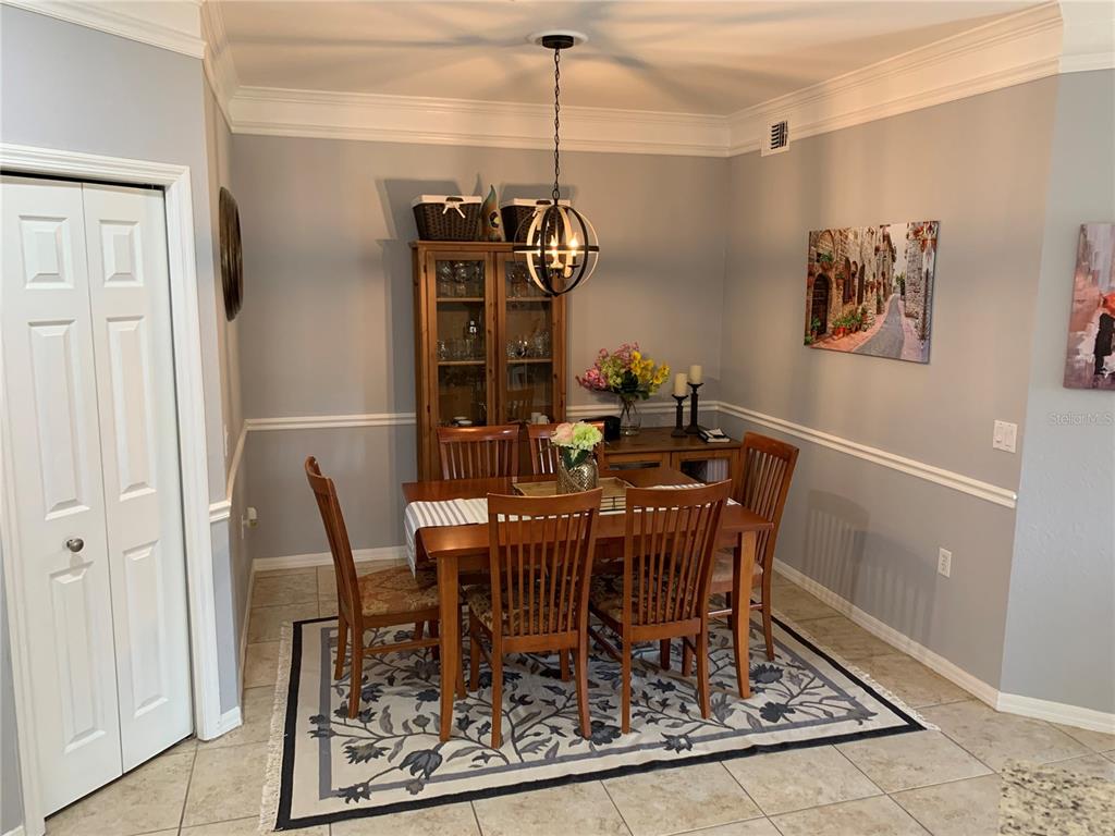 5134 Northridge Road, Unit 112 Sarasota, FL 34238 - Photo 5 of 15 a view of a dining room with furniture