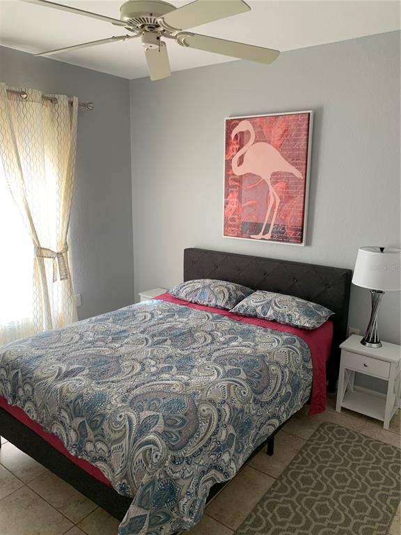 5134 Northridge Road, Unit 112 Sarasota, FL 34238 - Photo 8 of 15 a bedroom with a bed and a window