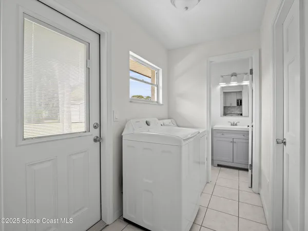 a bathroom with a toilet a sink a vanity and mirror