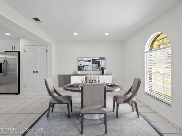 a kitchen with a sink window and cabinets