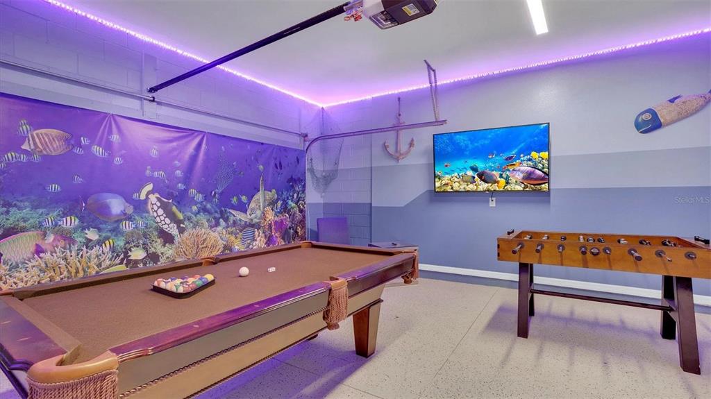 1840 Caribbean View Terrace Kissimmee, FL 34747 - Photo 11 of 56 a room with furniture and wall paintings