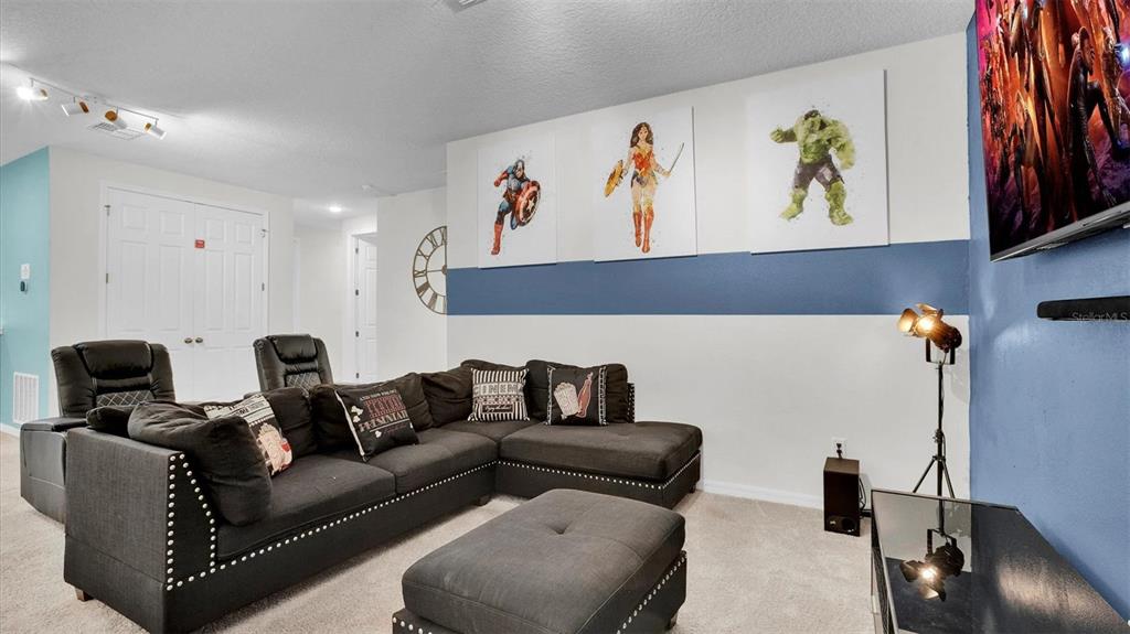 1840 Caribbean View Terrace Kissimmee, FL 34747 - Photo 37 of 56 a living room with furniture