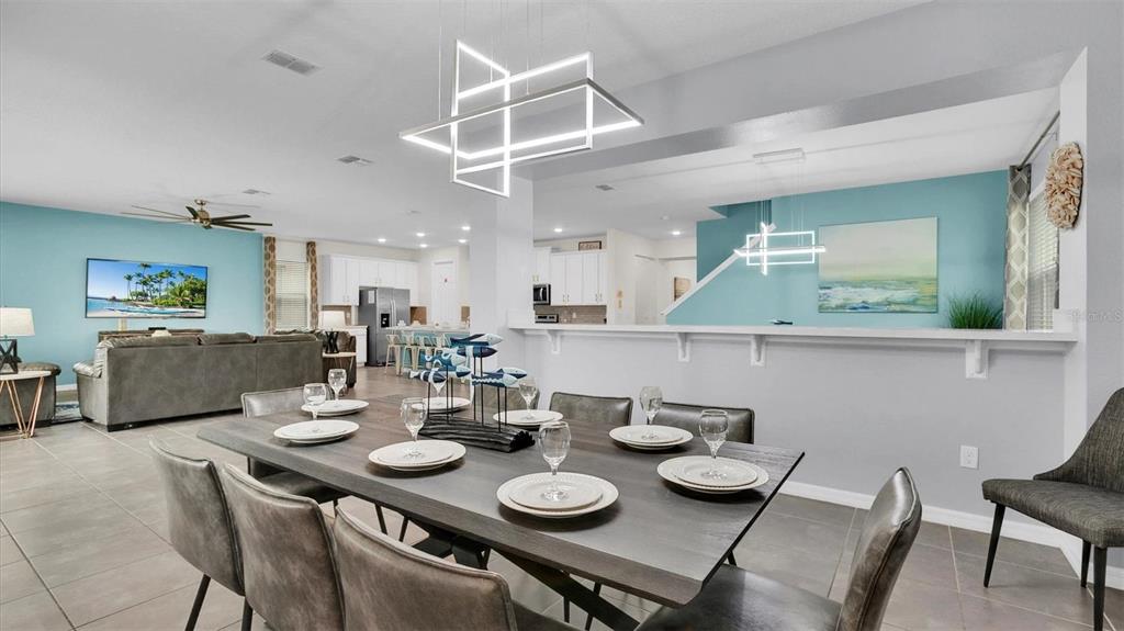 1840 Caribbean View Terrace Kissimmee, FL 34747 - Photo 6 of 56 a view of a dining room with furniture and a chandelier
