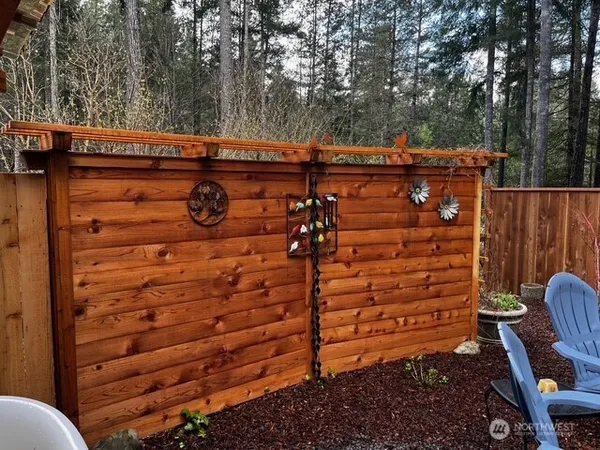 a view of a wooden door with a chair
