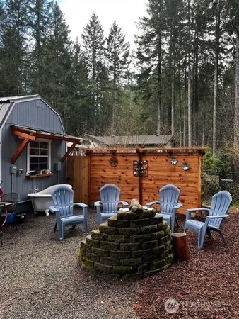 a view of a patio with iron fence