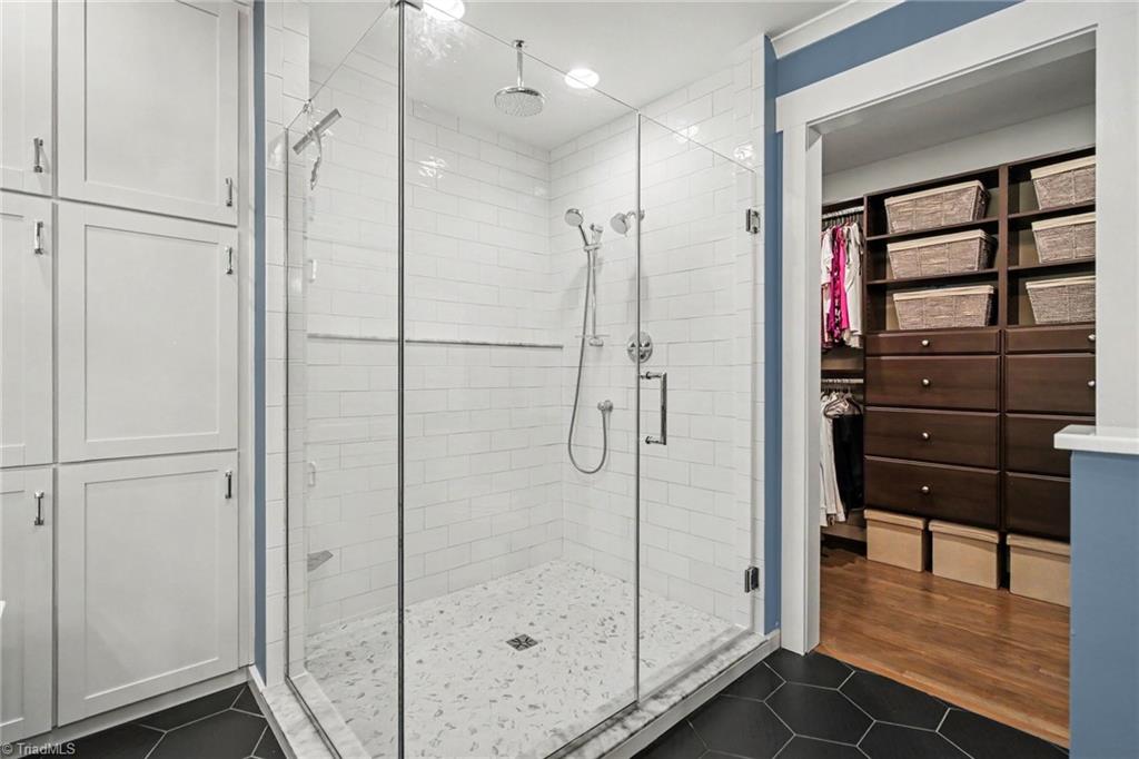 4517 Tower Road Greensboro, NC 27410 - Photo 21 of 35 Primary shower and custom walk-in closet