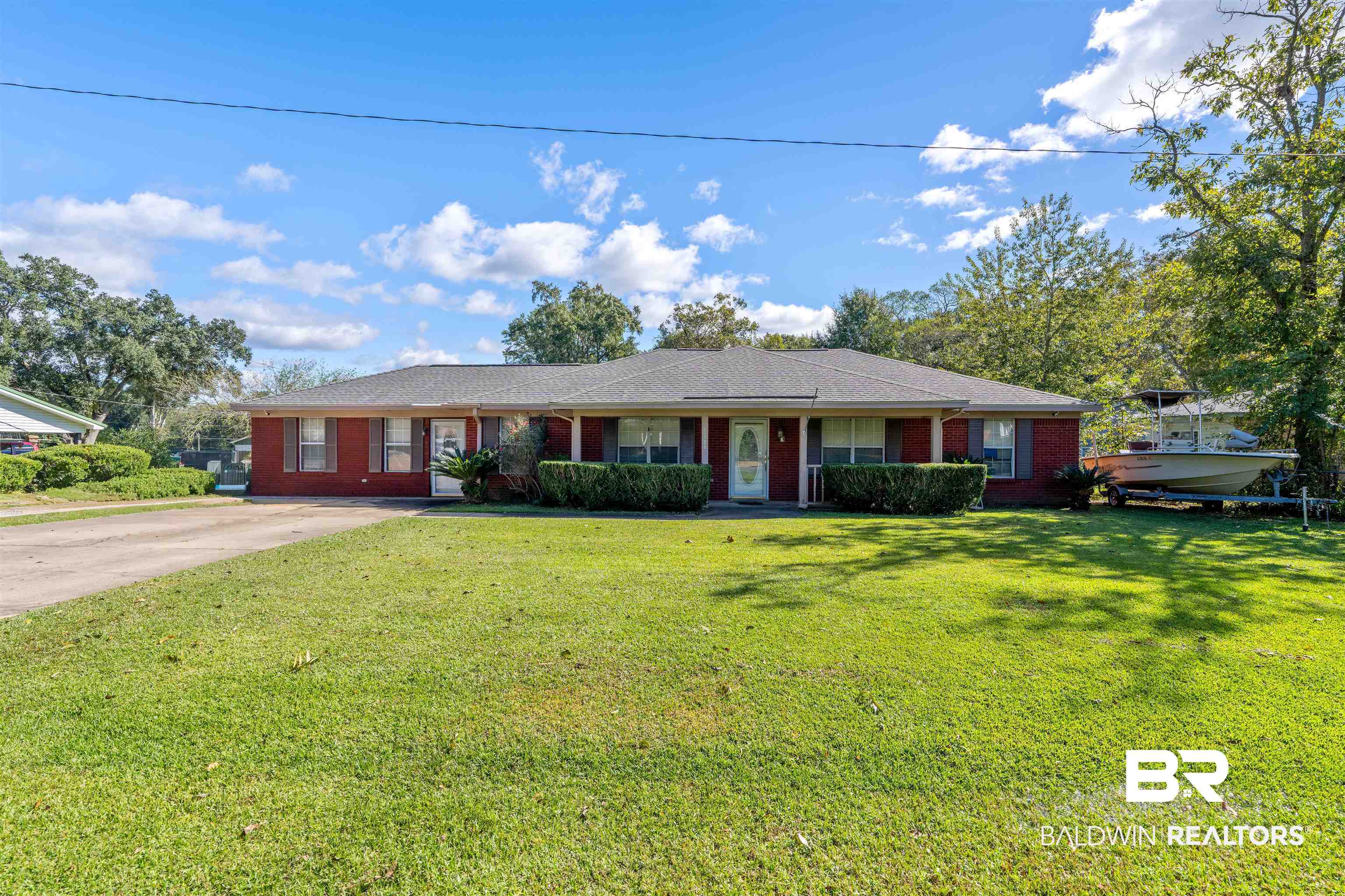23186 Pecan Street Robertsdale, AL 36567 - Photo 1 of 36 Single story home featuring a front yard, brick siding, and driveway