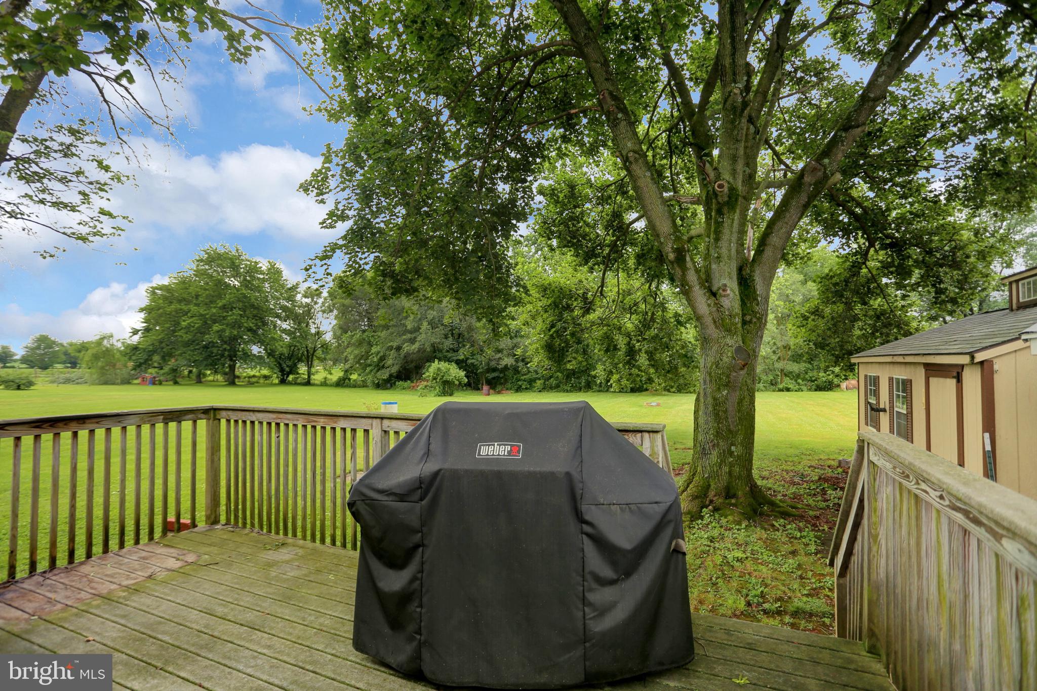6119 Middleburg Road Keymar, MD 21757 - Photo 47 of 50 a view of a wooden deck and a yard