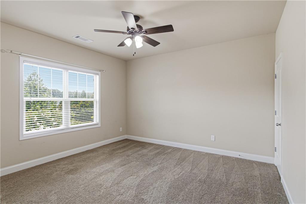 114 Madison Street Canton, GA 30115 - Photo 24 of 39 a view of an empty room with a window