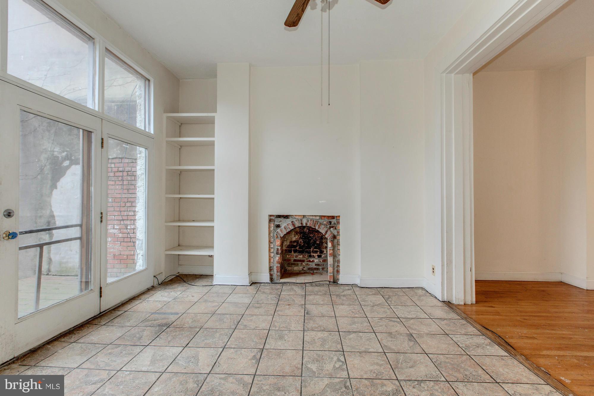 1305 Q Street Northwest Washington, DC 20009 - Photo 6 of 23 Huge transom windows, a wall of glass