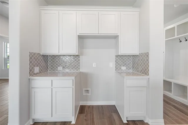 a room view with entryway and wooden floor