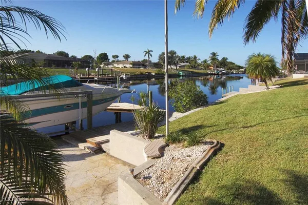 a view of a lake with a yard