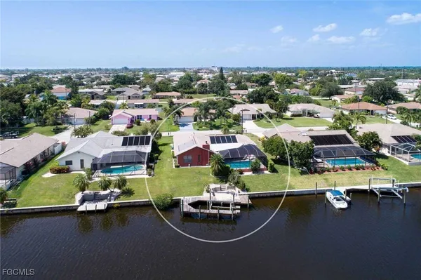 an aerial view of a swimming pool patio and mountain view