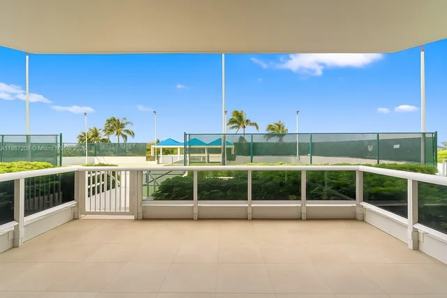 a view of a garden with an outdoor seating area