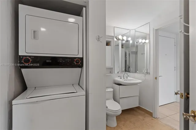 a view of a city with tall buildings and a big yard