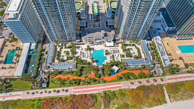 a view of swimming pool with outdoor seating