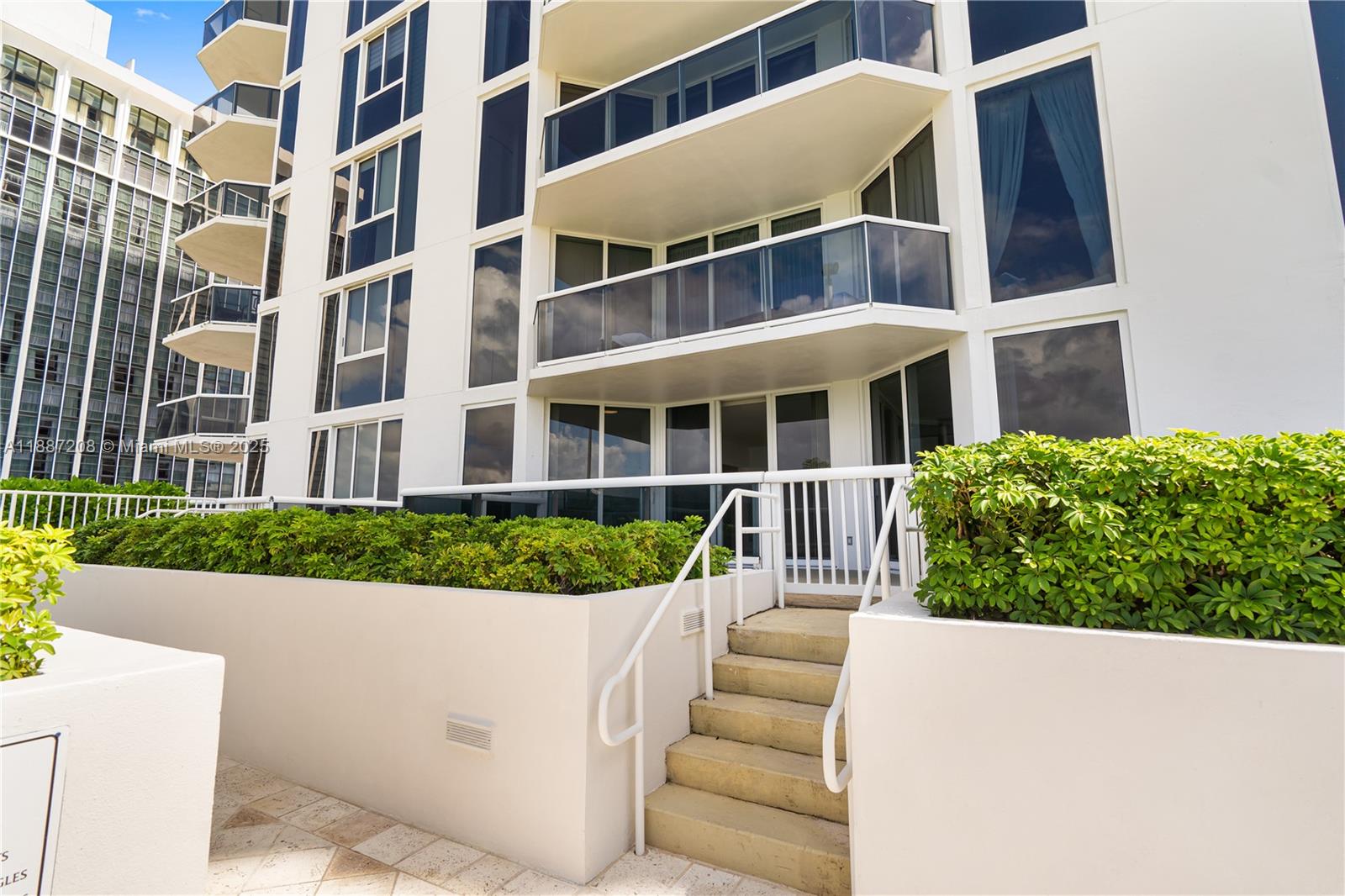 4779 Collins Avenue, Unit 506 Miami Beach, FL 33140 - Photo 6 of 53 a house view with a garden space