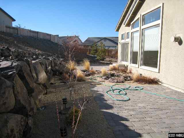 4522 Goodwin Road Sparks, NV 89436 - Photo 8 of 9 a view of a backyard with table and chairs