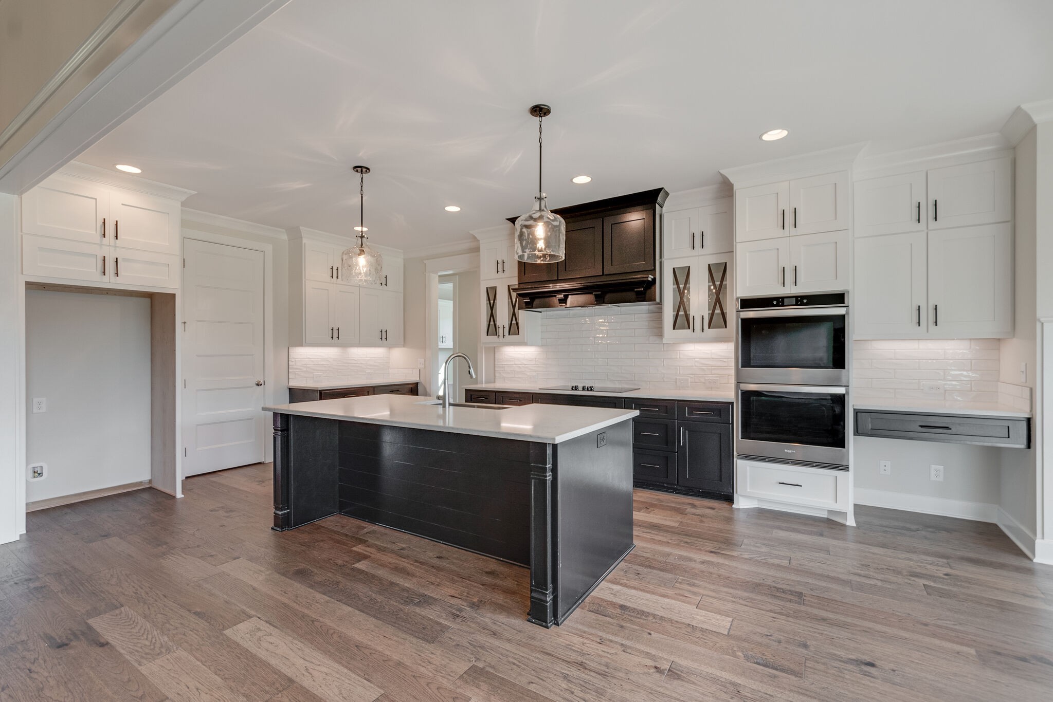 12599 North Milton Road Milton, TN 37118 - Photo 14 of 34 a kitchen with kitchen island granite countertop stainless steel appliances and wooden floor