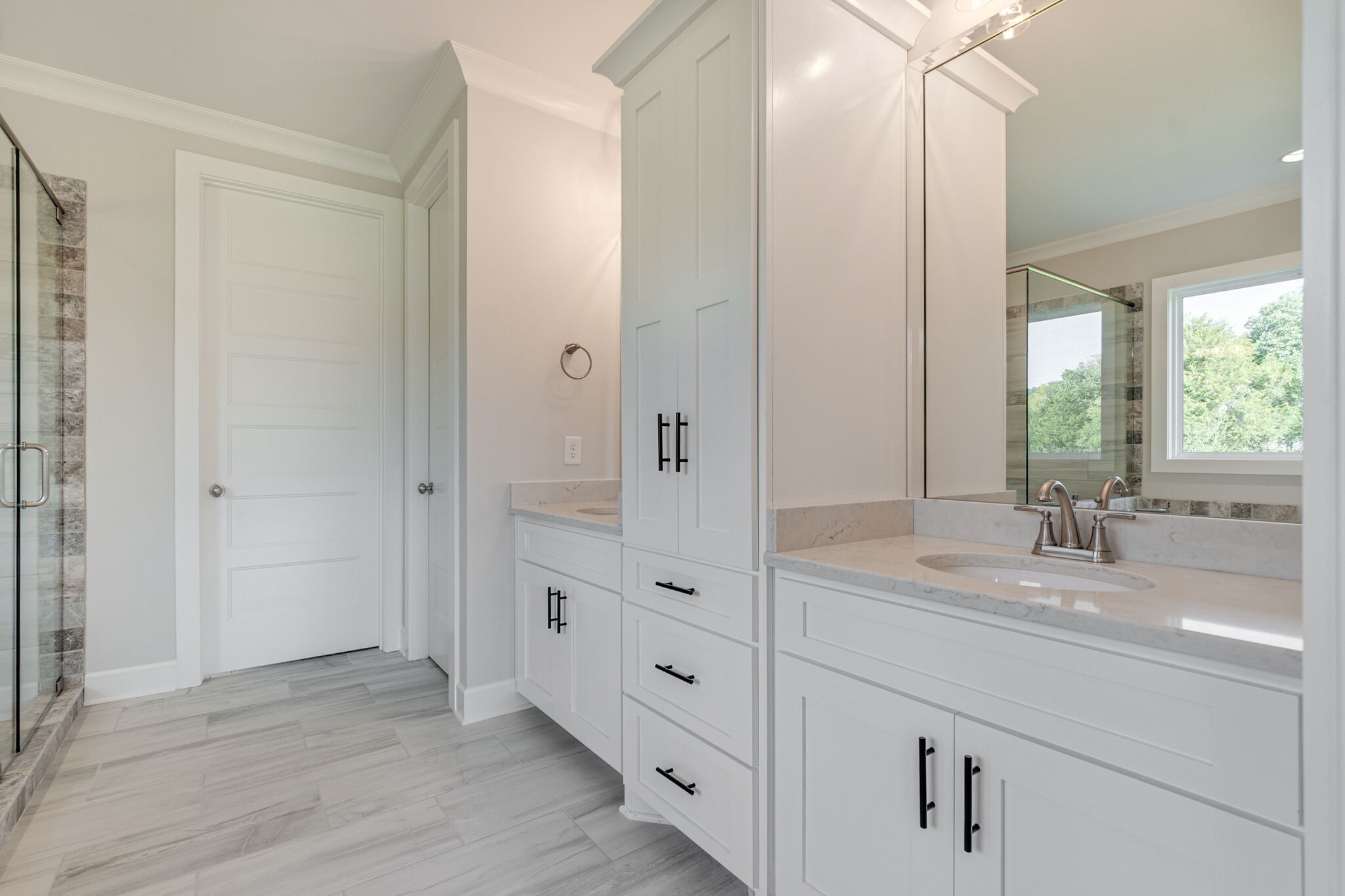 12599 North Milton Road Milton, TN 37118 - Photo 20 of 34 a bathroom with a double vanity sink and mirror with shower