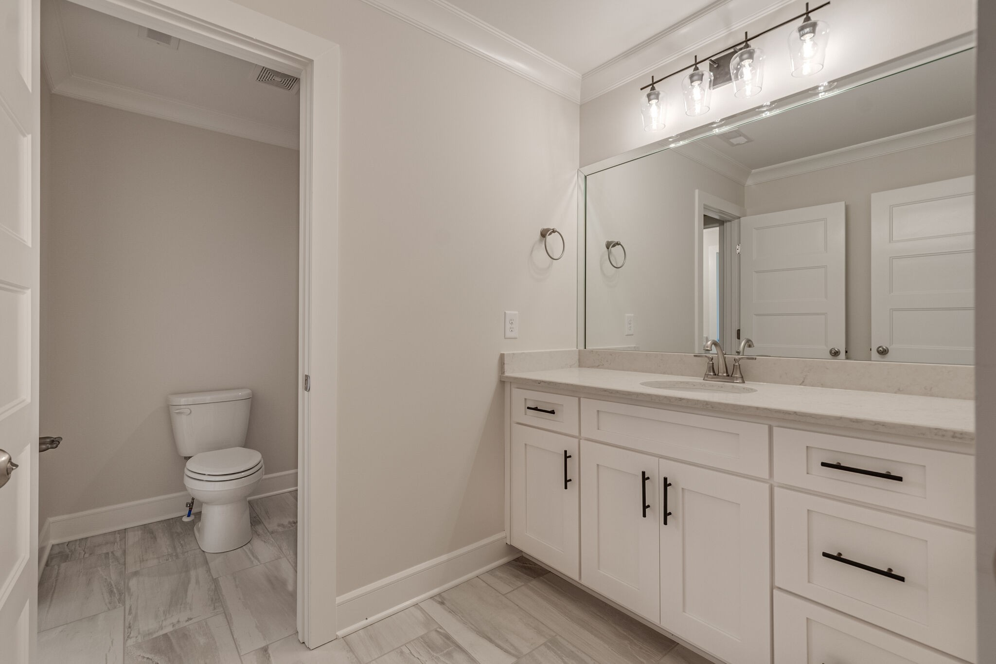 12599 North Milton Road Milton, TN 37118 - Photo 27 of 34 a bathroom with a sink a toilet and a mirror
