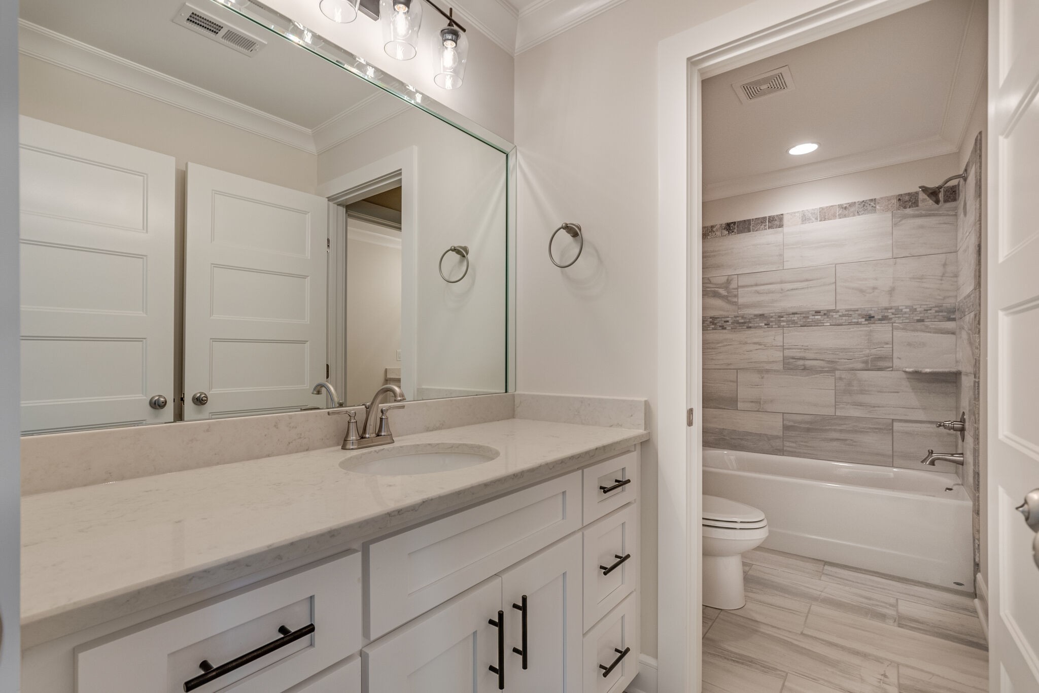 12599 North Milton Road Milton, TN 37118 - Photo 28 of 34 a bathroom with a granite countertop sink a toilet and shower
