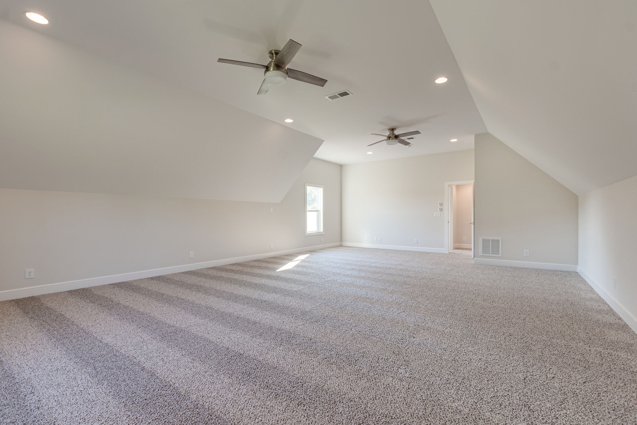 12599 North Milton Road Milton, TN 37118 - Photo 31 of 34 a view of a big room with a ceiling fan and windows