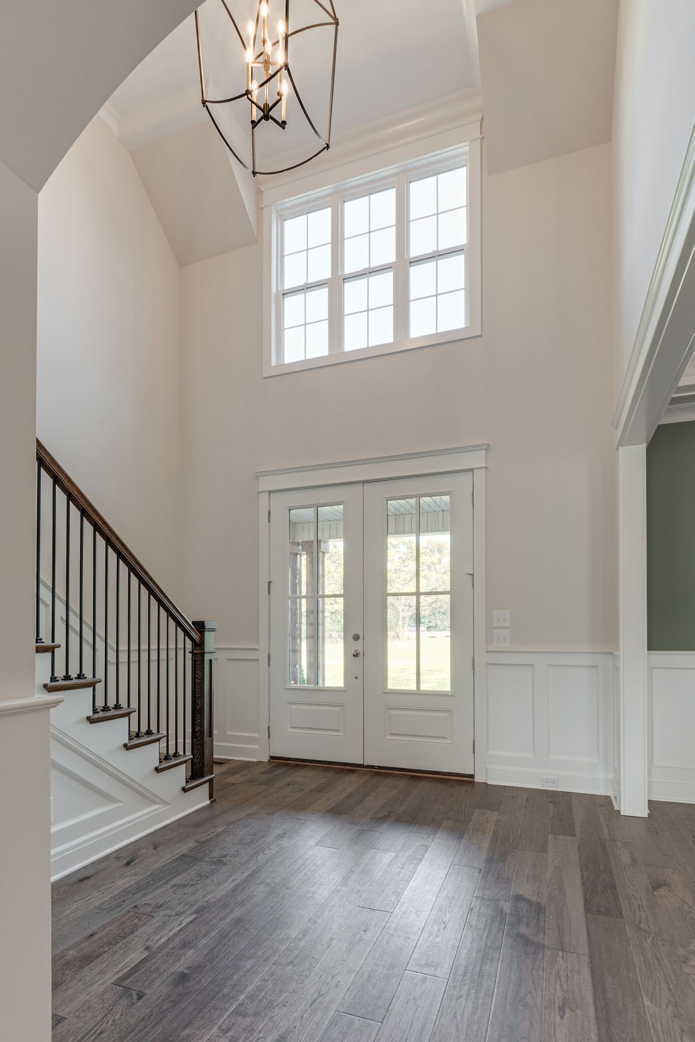 12599 North Milton Road Milton, TN 37118 - Photo 5 of 34 a view of an empty room with wooden floor and a window