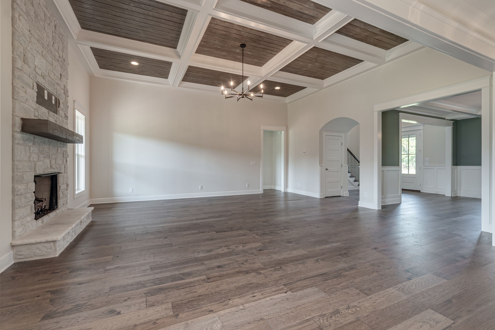 12599 North Milton Road Milton, TN 37118 - Photo 10 of 34 an empty room with wooden floor fireplace and windows