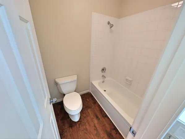 a bathroom with a toilet and a sink