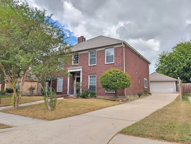 a house view with a garden space