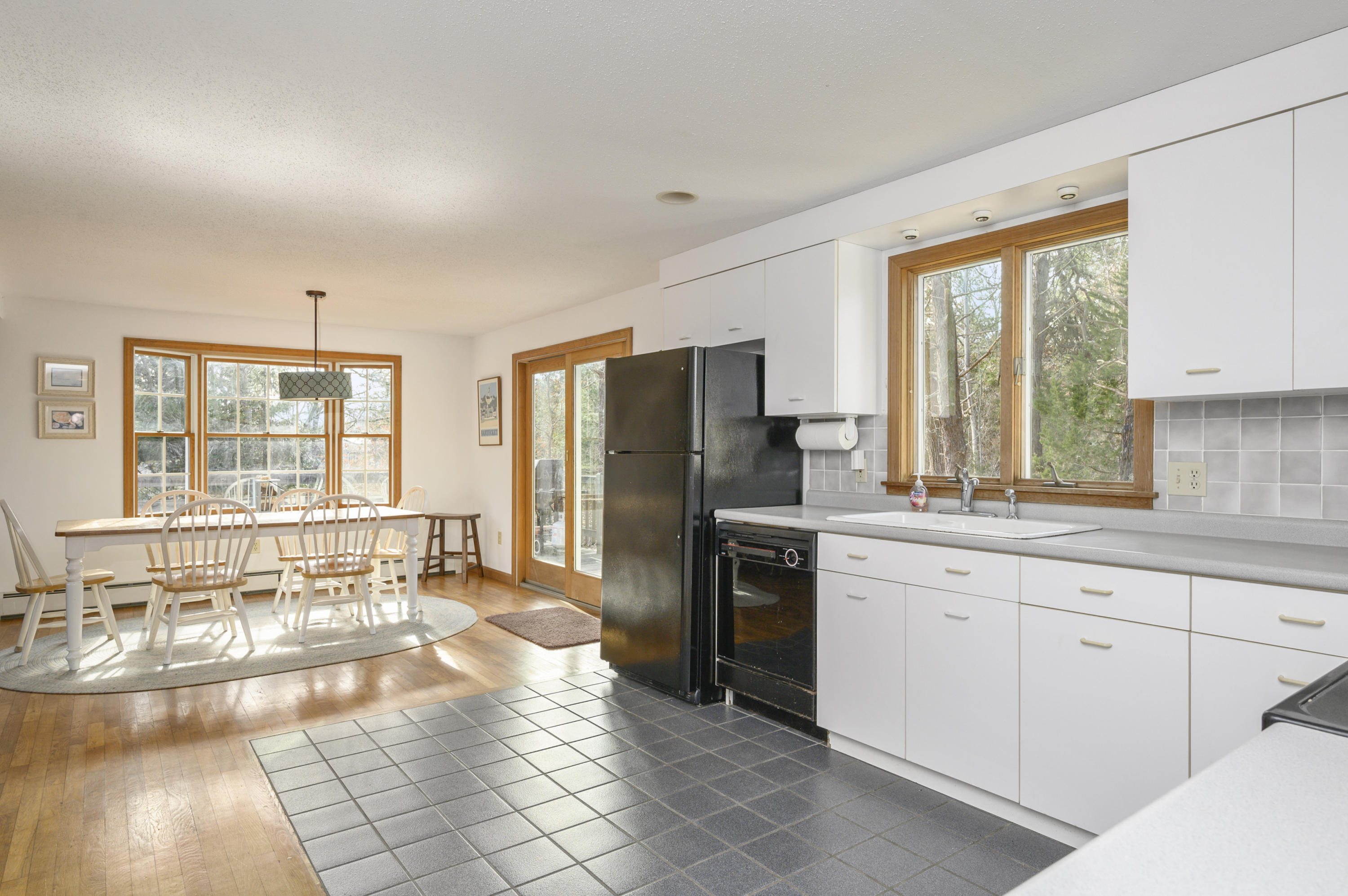 40 Pheasant Run Eastham, MA 02642 - Photo 13 of 20 a large kitchen with kitchen island granite countertop a large counter top stainless steel appliances a sink and cabinets