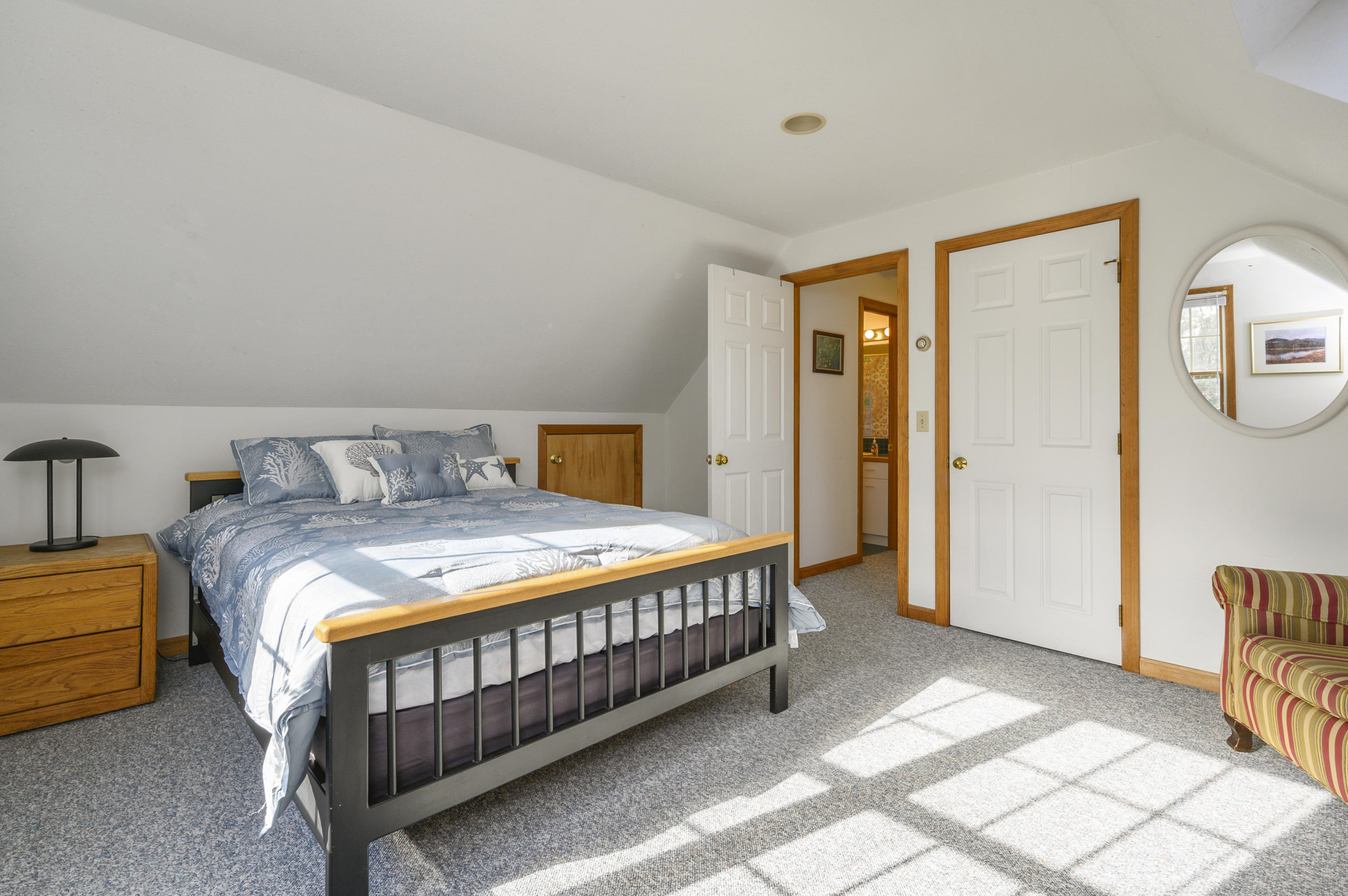 40 Pheasant Run Eastham, MA 02642 - Photo 18 of 20 a bedroom with a bed and wooden floor