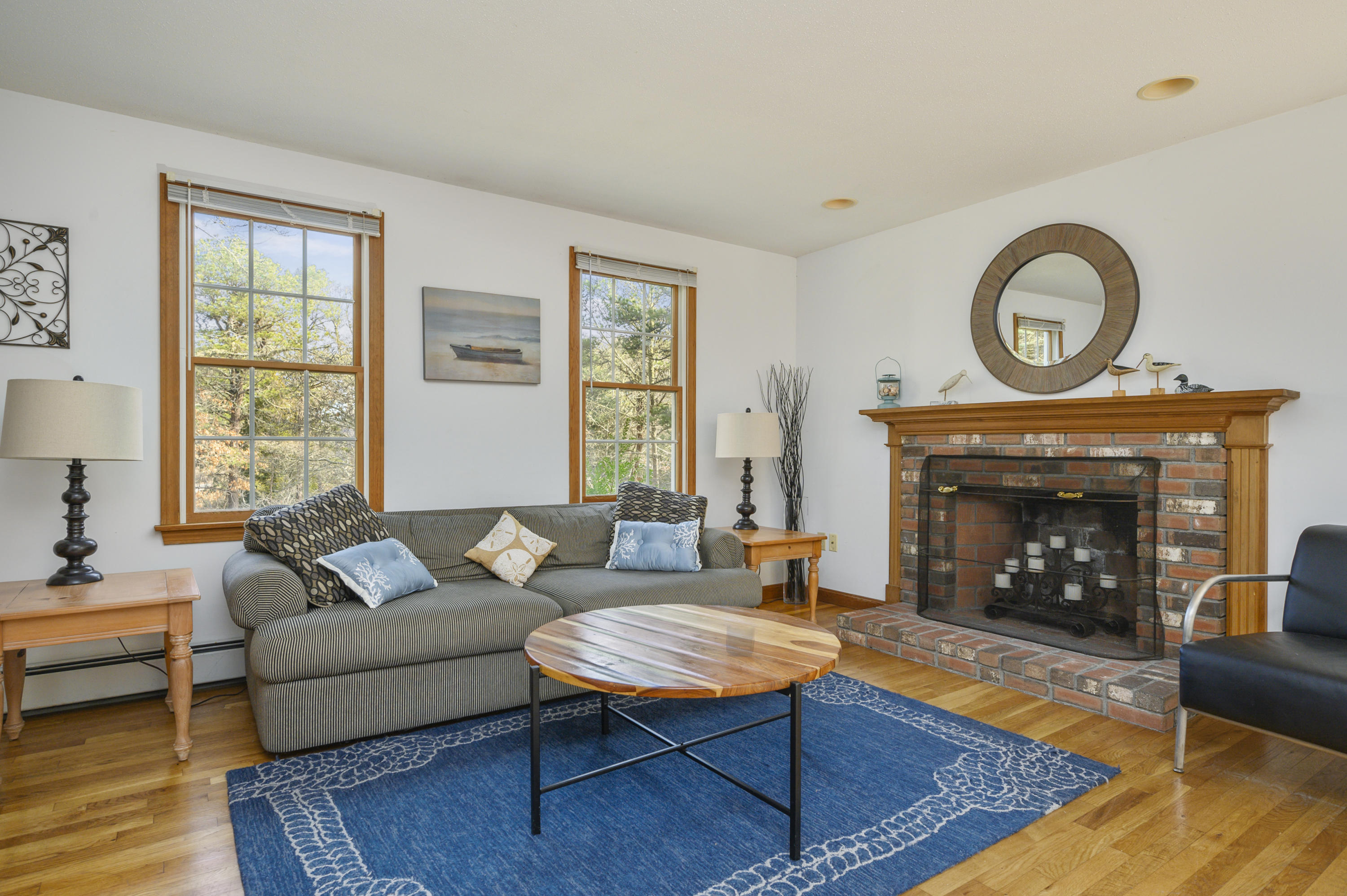 40 Pheasant Run Eastham, MA 02642 - Photo 7 of 20 a living room with furniture and a fireplace