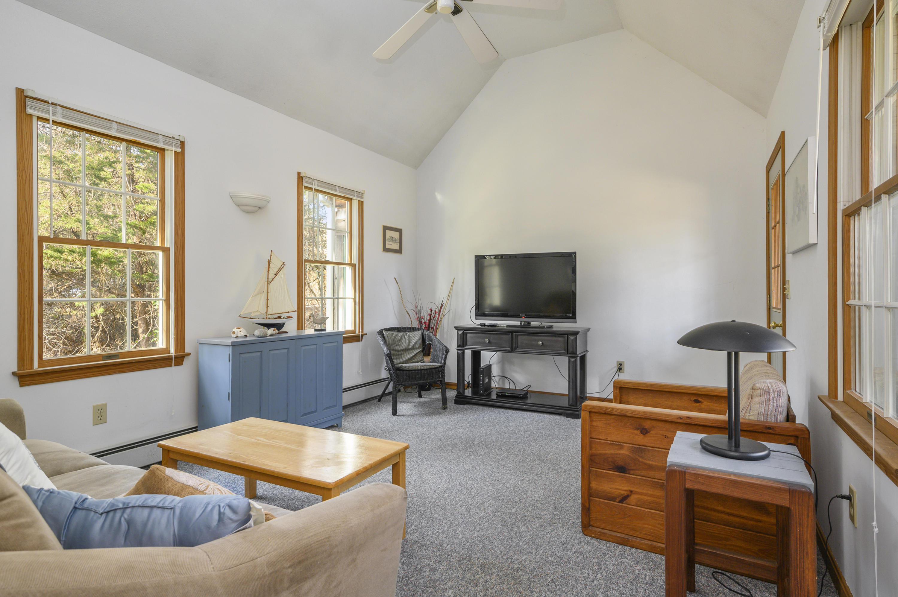 40 Pheasant Run Eastham, MA 02642 - Photo 10 of 20 a living room with furniture and a flat screen tv