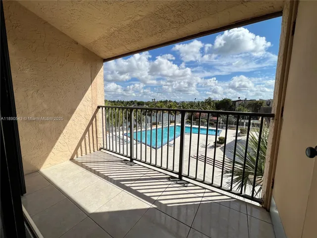 a view of balcony with wooden floor
