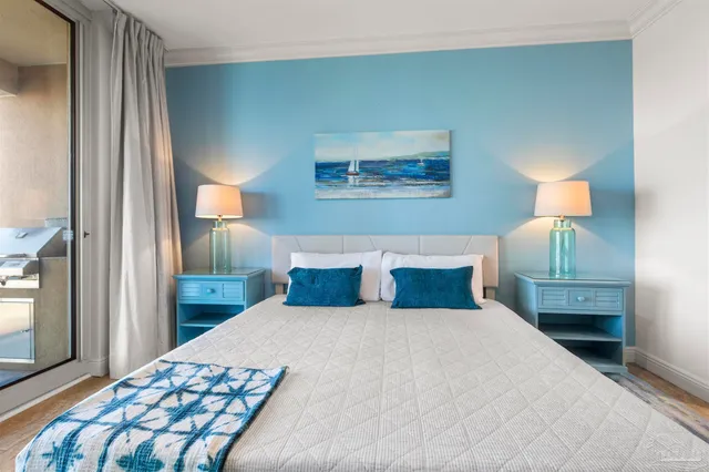 a bedroom with a bed and a lamp