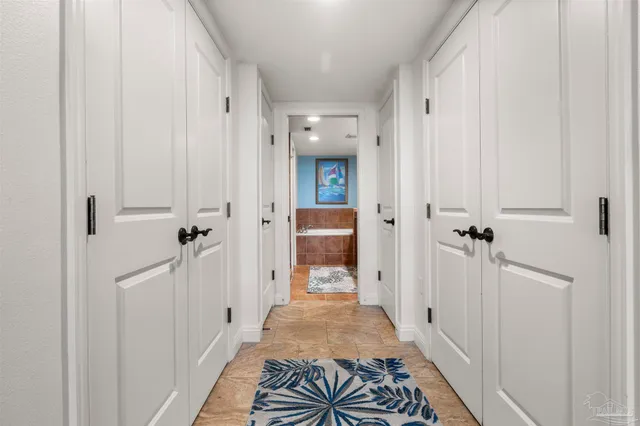 a view of a hallway with a livingroom and a dinning room