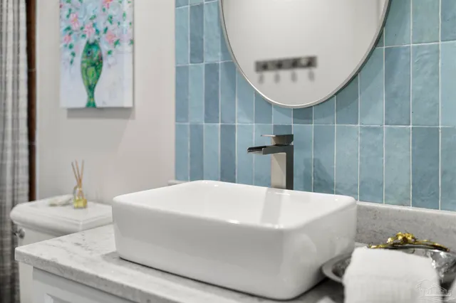 a living room with furniture potted plant and a large window