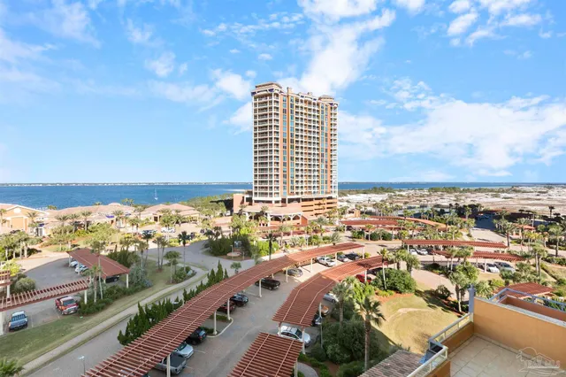 a view of a balcony with an outdoor seating